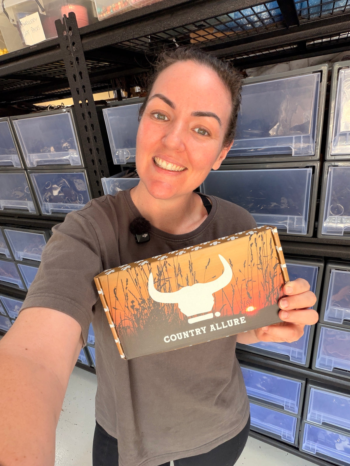 Ange holding a Country Allure Mystery Pick gift box